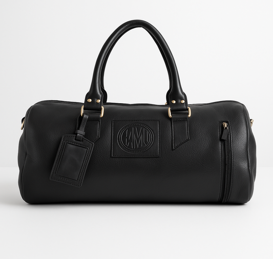 Black leather duffel bag with a brand logo on a white background