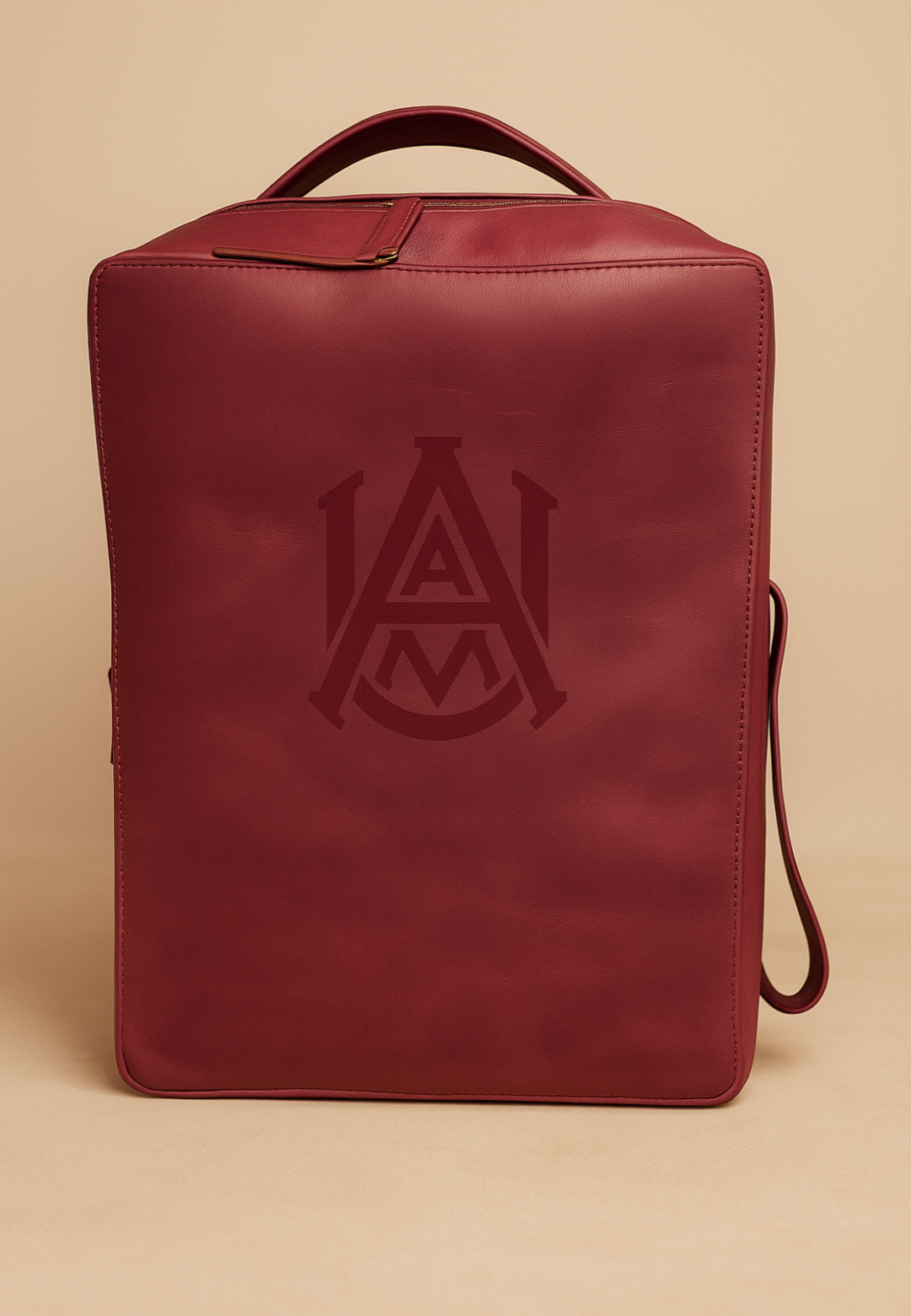 Red leather shoe bag with a logo on a beige background