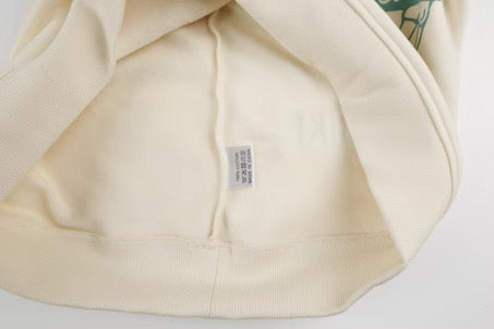 Close-up of a beige fabric with a label on a white background