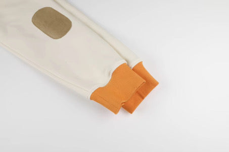 Beige and orange sleeve with a patch on a white background