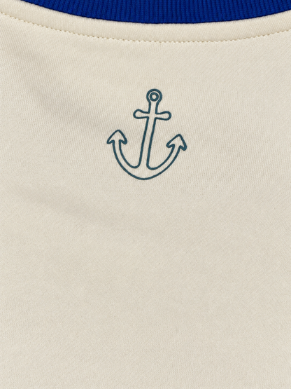 Close-up of the anchor graphic below the royal blue back collar on the Hampton sweatshirt.