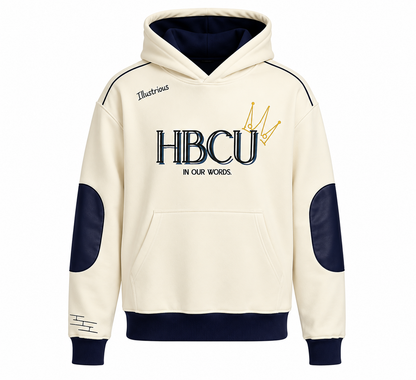 The front view of the Legacy HBCU Hoodie. An off-white hooded sweatshirt with navy blue accents, featuring 'HBCU IN OUR WORDS' and a gold crown graphic on the chest, with navy blue elbow patches and ribbed cuffs.